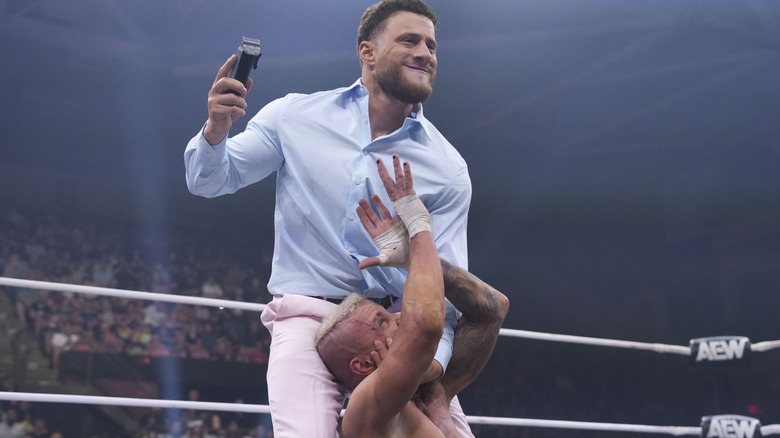 MJF looks to attack Darby Allin with a pair of hair clippers in the ring during an episode of "AEW Dynamite."