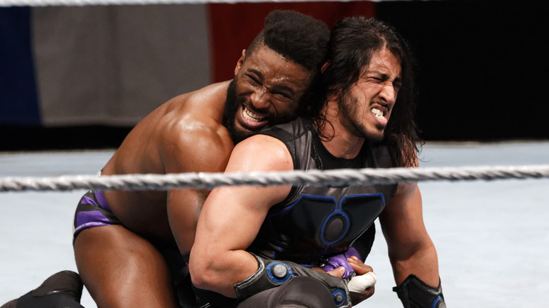 Cedric Alexander and Mustafa Ali wrestling each other