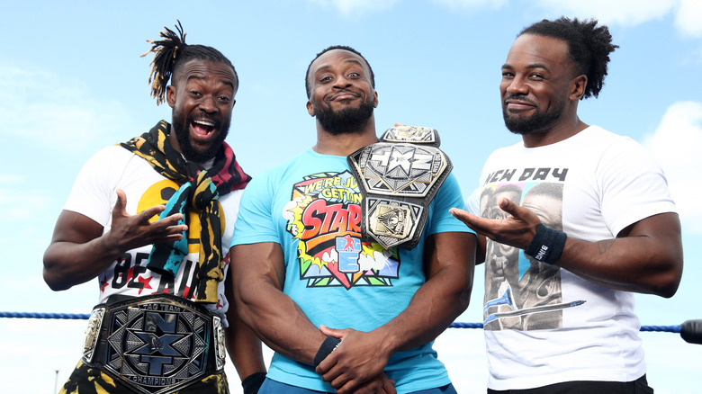Kofi Kingston, Big E and Xavier Woods pose during a media call at Bondi Beach