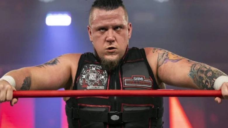 Sami Callihan leans on the ropes and stares up the ramp following a match in TNA Wrestling.