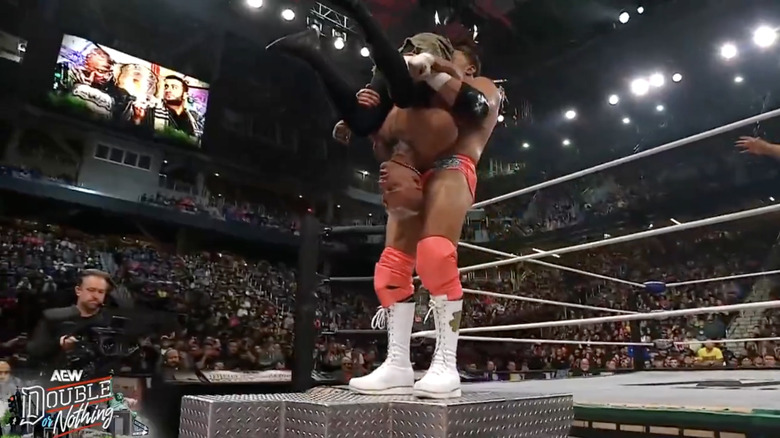 MJF with Allin up for a piledriver on top of the ring steps.