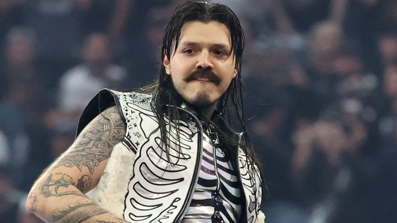 Dominilk Mysterio wearing a white vest