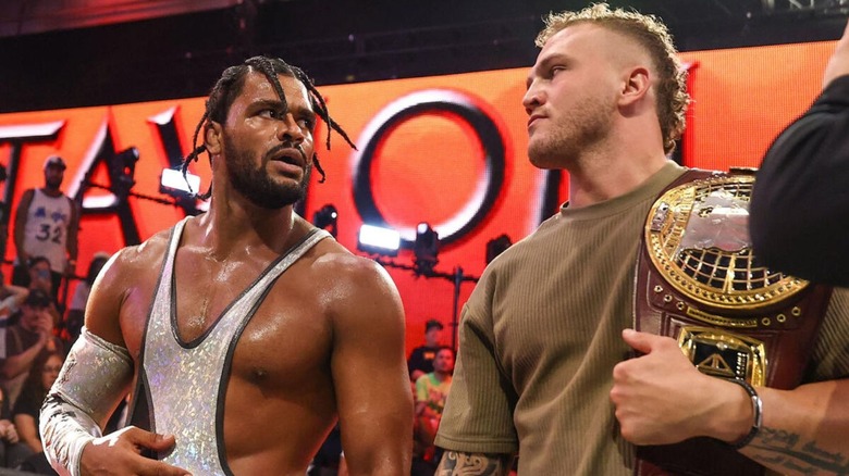 Tavion Heights and North American Champion Myles Borne stare one another down at ringside during an episode of "WWE NXT."