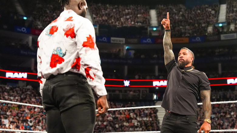 Jey Uso points a finger in the air as Oba Femi stares him down on "WWE Raw"