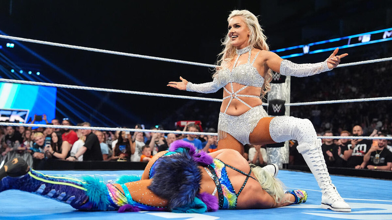 Blake Monroe poses over a fallen Giulia in the ring on "WWE SmackDown"