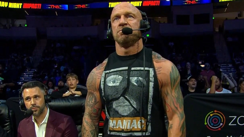 Eric Young wearing a headset