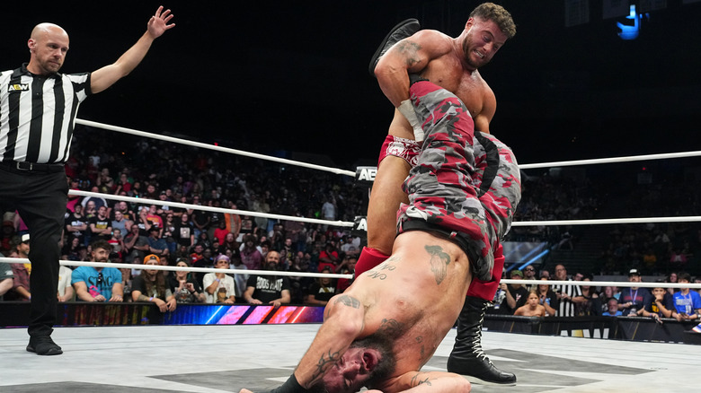 MJF looks to put Mark Briscoe in a submission in the middle of the ring during a match on an August 2025 edition of "AEW Dynamite."