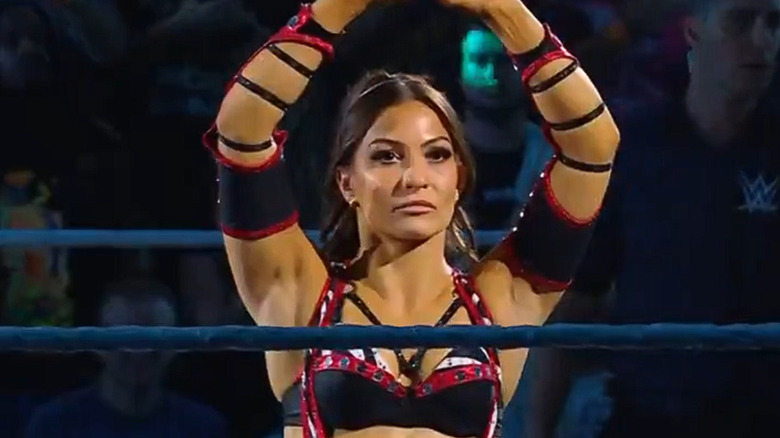 Kendal Grey raising her arms