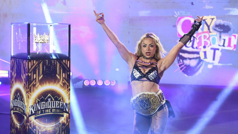 Liv Morgan next to the case with the Queen of the Ring crown