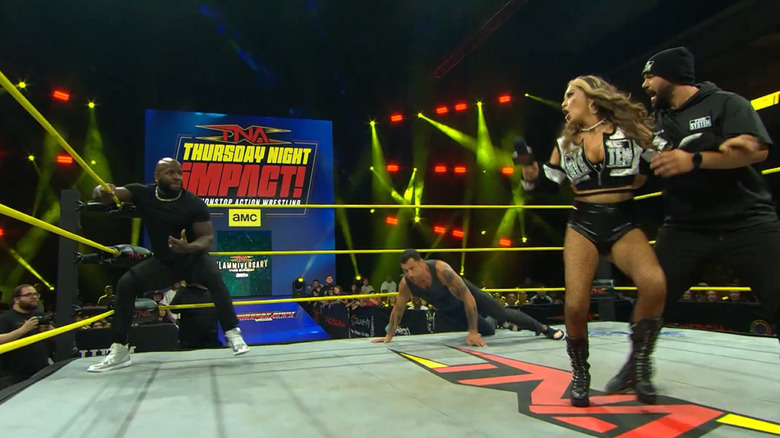 Moose sets up a spear on Alisha Edwards