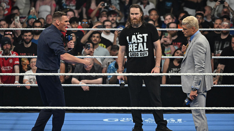 GUNTHER speaks in the ring alongside Sami Zayn and Cody Rhodes on "WWE SmackDown"