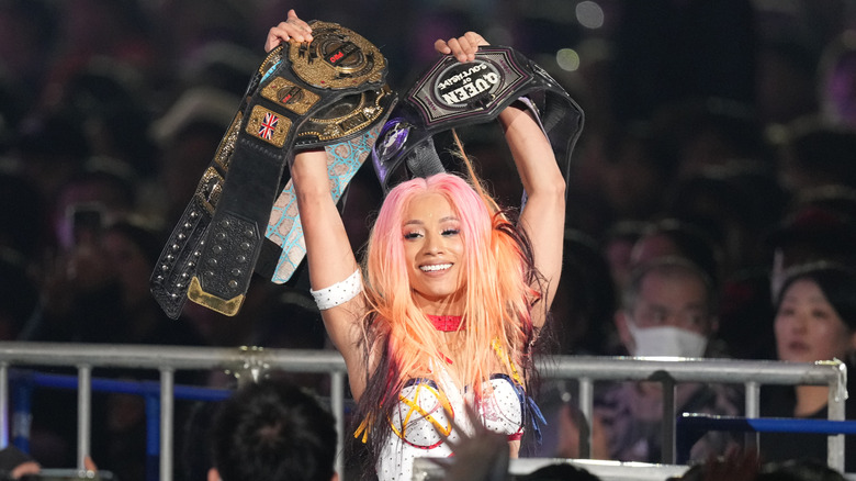 Mercedes Mone celebrates with many title belts