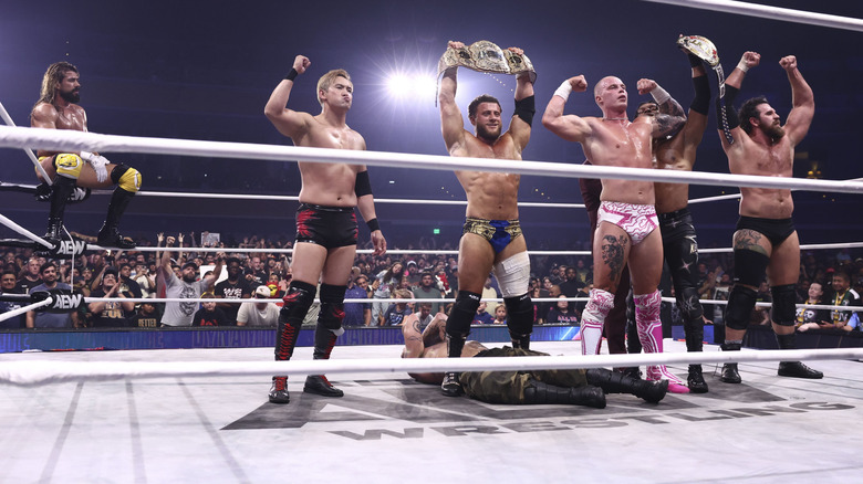 Team MJF poses in the ring standing over a fallen Mark Briscoe, though Andrade sits on the top rope in the corner, to end an episode of "AEW Dynamite."