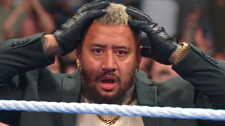 Solo Sikoa holding his hands to his head on "WWE SmackDown"