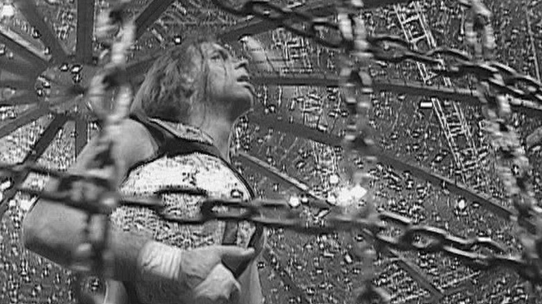Shawn Michaels holds the World Heavyweight Title in greyscale
