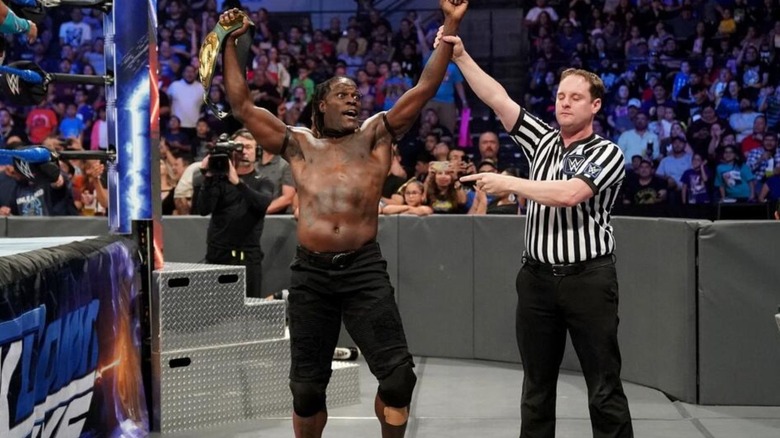 A referee raises the hand of R-Truth after one of his victories for the 24/7 Championship on "WWE SmackDown."