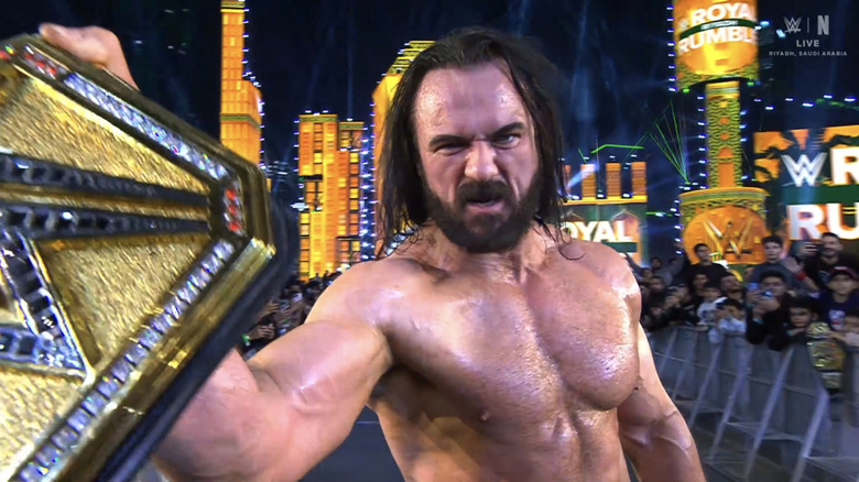 Drew McIntyre glowers at the camera as he holds his Undisputed WWE Championship up during Riyadh's Royal Rumble.
