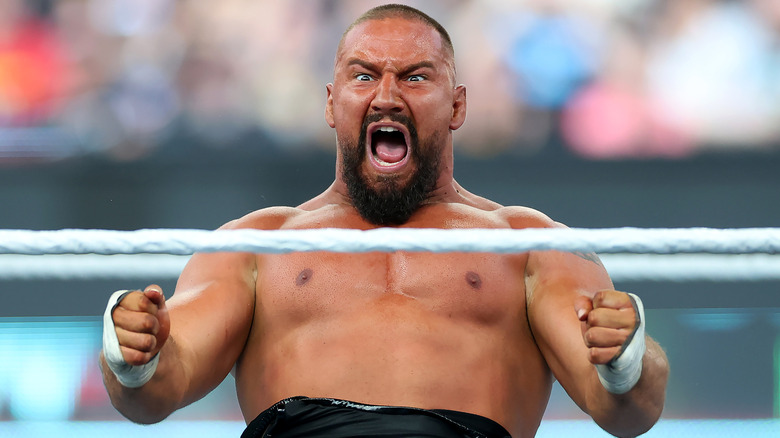 Bron Breakker's face flushes red as he shouts.