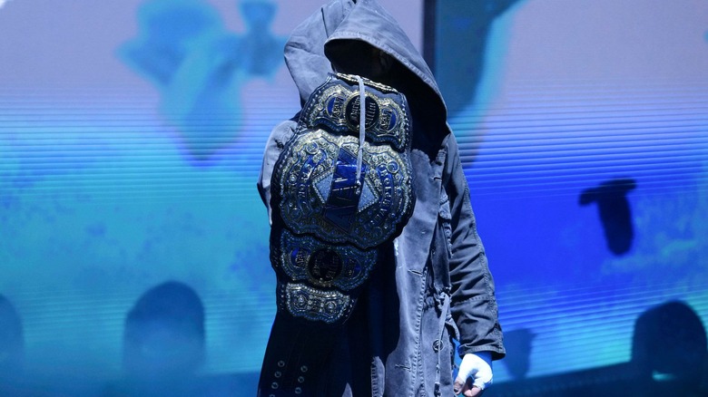 Darby Allin makes an entrance with the AEW World Title