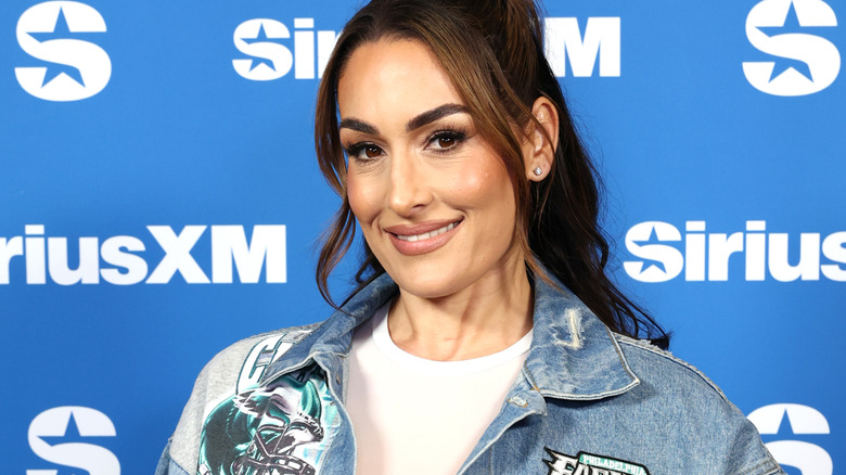 Nikki Bella wearing a denim jacket