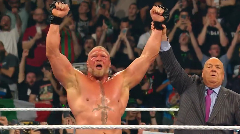 Brock Lesnar celebrates victory with Paul Heyman