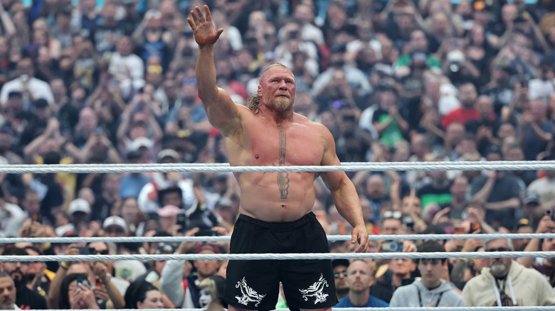 Brock Lesnar waves the crowd off after taking a massive fall to Oba Femi at WrestleMania 42. He would leave his boots and gloves in the ring, indicating his retirement (at the time)