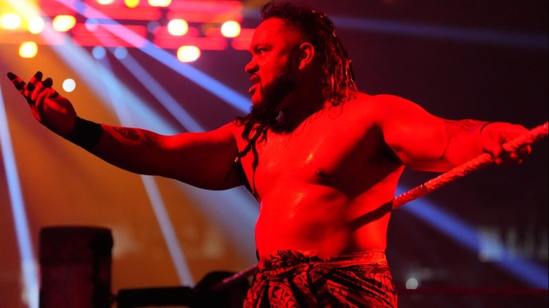 Jacob Fatu acknowledges the crowd on the ring apron before heading into this Tribal Combat match with Roman Reigns at WWE Clash in Italy