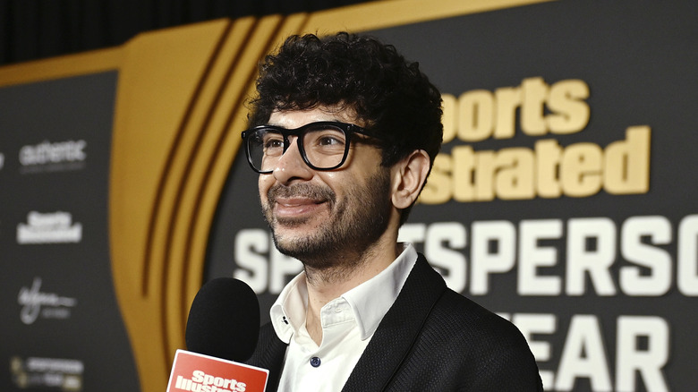 Tony Khan with a smile on his face