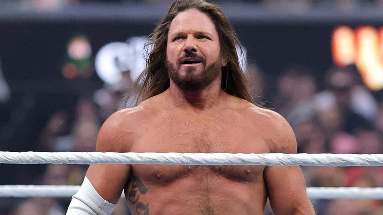 AJ Styles standing in a wrestling ring