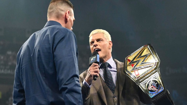 Undisputed WWE Champion Cody Rhodes holds up the championship while cutting a promo on GUNTHER in the ring during the May 29 edition of "WWE SmackDown."