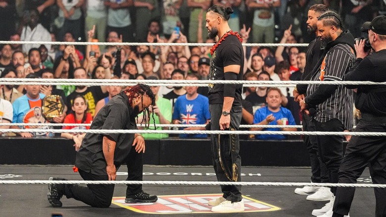 Jacob Fatu kneels before World Heavyweight Champion Roman Reigns, who is flanked by The Usos, during the acknowledgment ceremony on the June 1, 2026 edition of "WWE Raw."