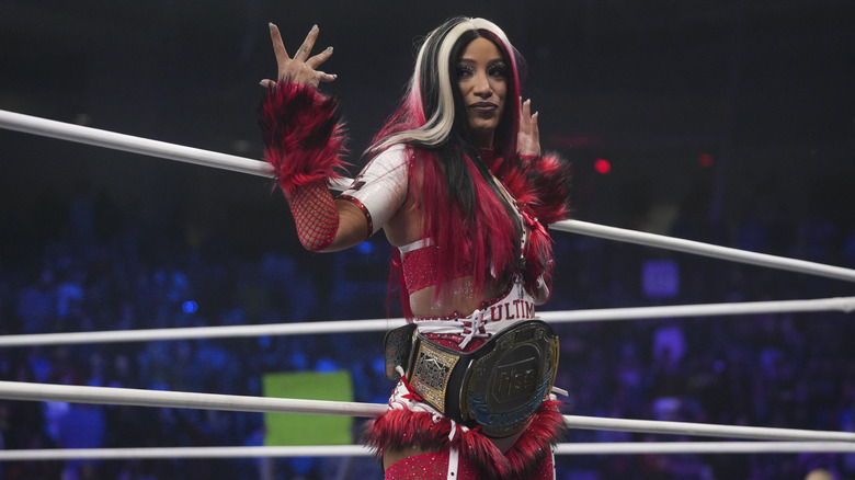 AEW star Mercedes Mone poses on the ropes, TBS Championship around her waist, during the December 31, 2025 episode of "AEW Dynamite."