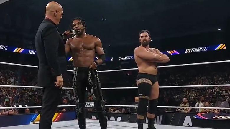 Kevin Knight, Don Callis, and Jake Doyle in the ring