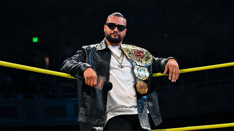 TNA World Champion Mike Santana leans in the corner of the ring during an episode of "TNA iMPACT."
