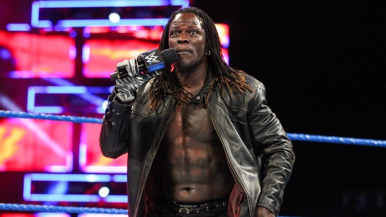 R-Truth in ring cutting a promo during a WWE show.