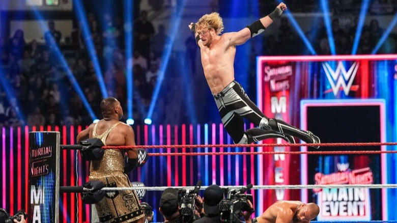 Logan Paul flies towards the corner, where Angelo Dawkins is cornered.
