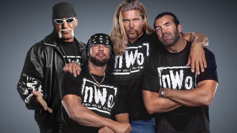 The original faces of the New World Order (Hulk Hogan, Sean Waltman, Kevin Nash, and Scott Hall) all pose together in a backstage photo shoot
