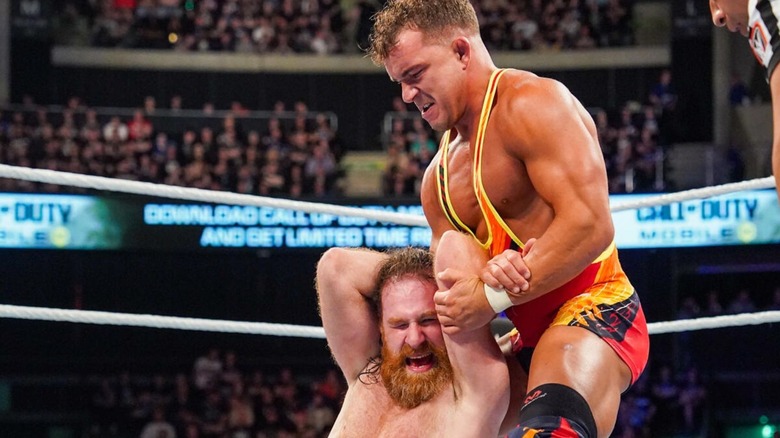 Chad Gable puts Sami Zayn in a hold during their match for the Intercontinental Championship.