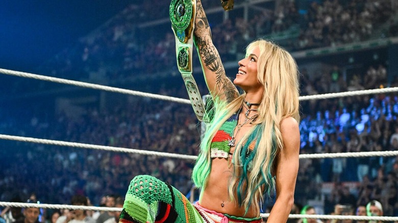 Sol Ruca raises the Women's Intercontinental Championship in the ring before a promo segment on "WWE Raw."