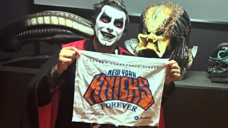 Danhausen holds up a New York Knicks towel