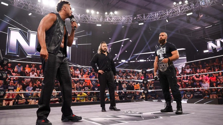 Kam Hendrix cuts a promo on NXT Champion Tony D'Angelo in the ring, as Nakaru looks on, during an episode of "WWE NXT."