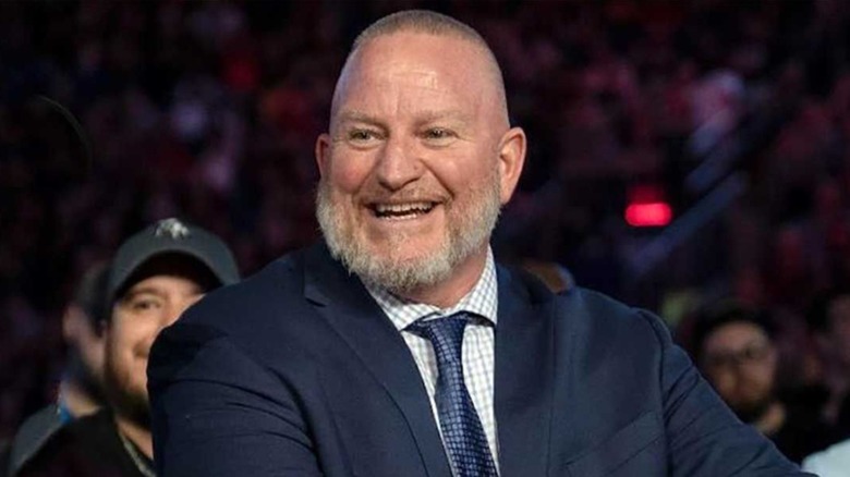 Brian James, aka Road Dogg, sitting at a desk