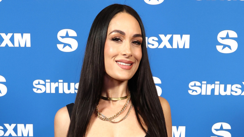 Brie Bella poses for a photo at SiriusXM on Radio Row at Super Bowl LX