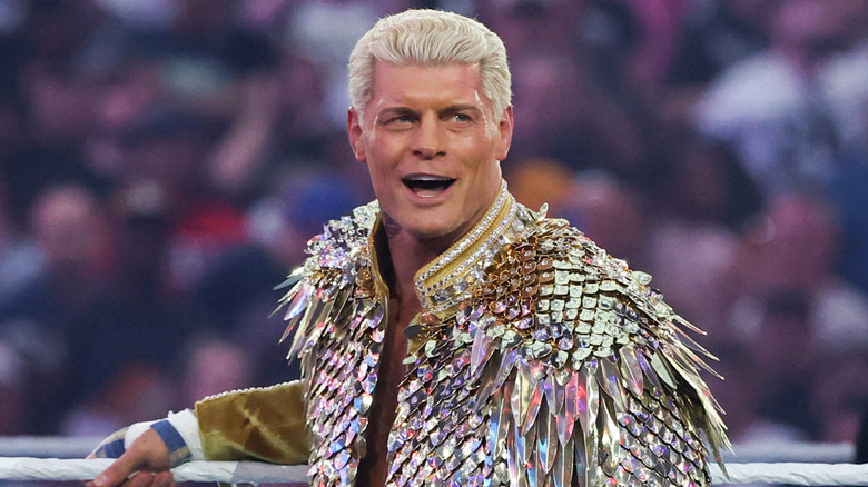 Cody Rhodes wearing an elaborate costume and smiling