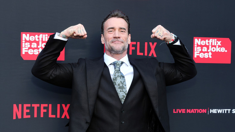 CM Punk shows off the muscles