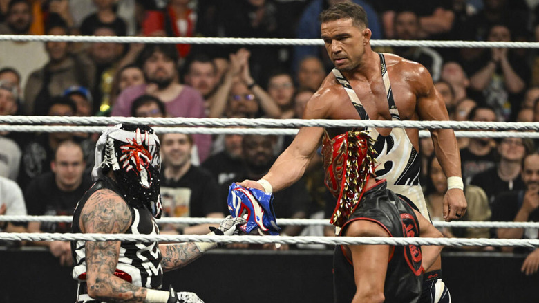Chad Gable handing a lucha mask to Penta on "WWE Raw"