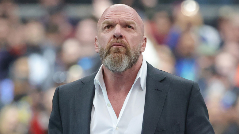 Triple H wearing a suit