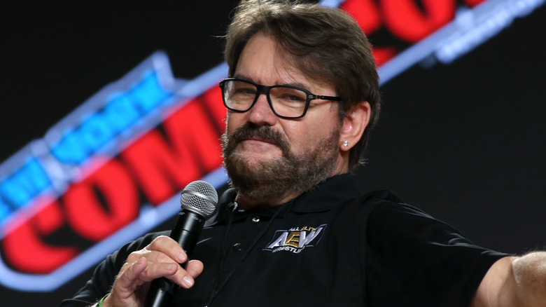 Tony Schiavone holding a microphone