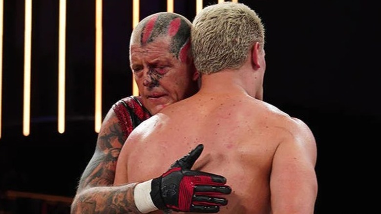 Dustin hugs his brother Cody during one of their matches in AEW