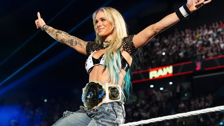 Sol Ruca gives the surfs up gesture before defending her WWE Women's Intercontinental Championship on 